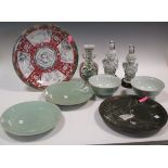 A quantity of Chinese wares to include two blanc de chine figures, celadon plates and bowls and