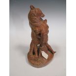A terracotta figural group, of a bear protecting her cub by E. Fremiet 30cm high