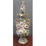 A 19th century Coalbrookdale style two handled lidded vase encrusted with flowers, 76cm high