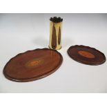 Two mahogany small trays inlaid with shells within wavy galleries together with a brass shell