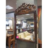 A reproduction walnut framed mirror 83 x 53cm