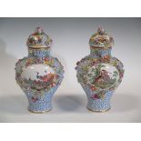 A pair of 'AR' floral encrusted vases, each painted with birds, the opposing panels with courting