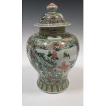 A 20th century Chinese famille verte vase and cover, together with a Chinese blue and white vase (
