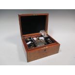 A burr walnut jewellery box containing a quantity of gold, silver, gem set and costume jewellery and