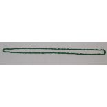 A jadeite green bead necklace