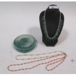 A childs turquoise and seed pearl fringe necklace with barrel clasp stamped '9c' , 30cm long, in a