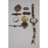 A lady's 9ct wristwatch, a 9ct garnet and pearl bar brooch, a locket set with hairwork and a