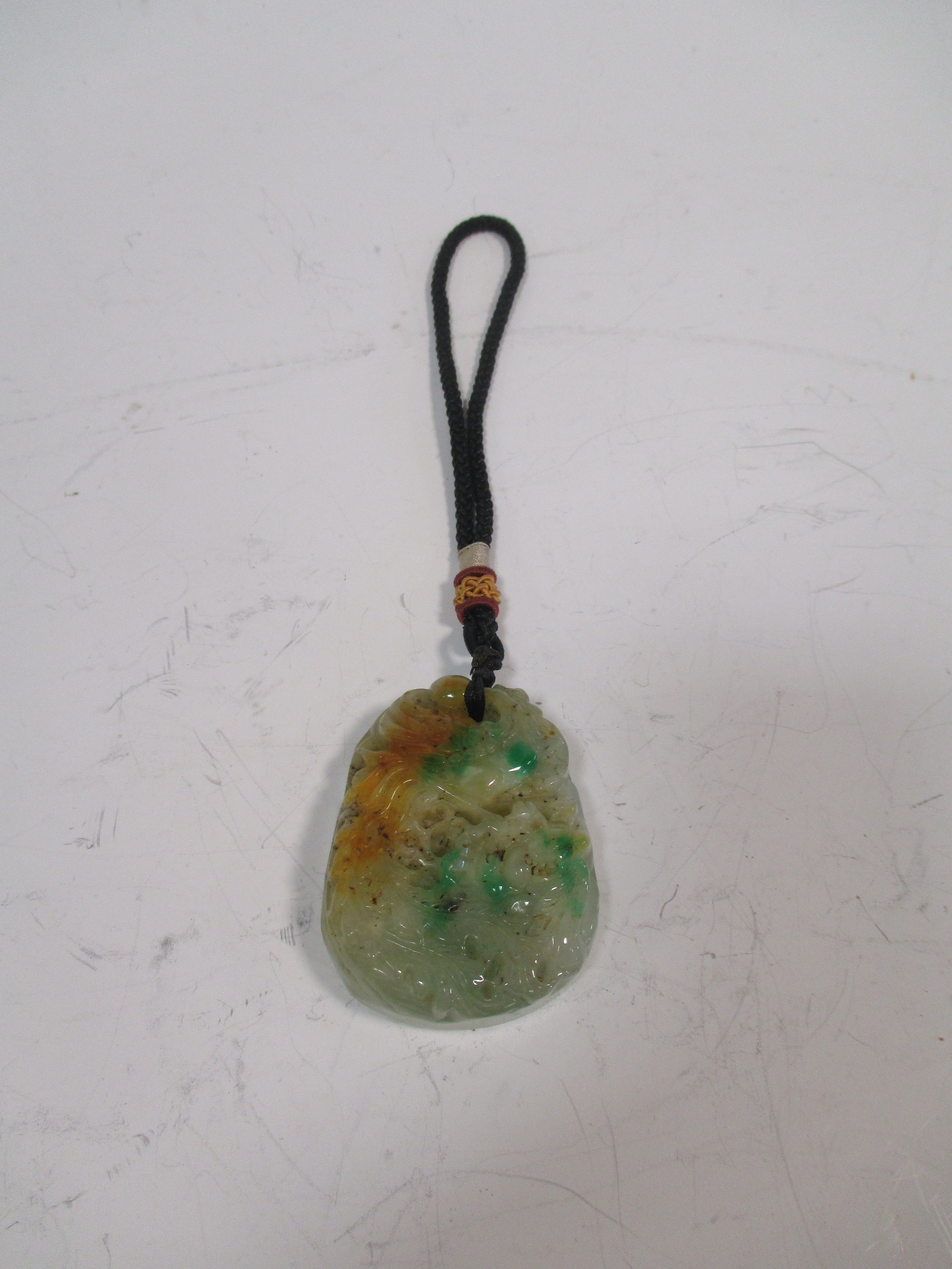 A Chinese jadeite pendant