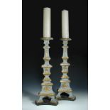A pair of 19th century Iberian gilt decorated carved wood pricket candlesticks, the knopped