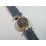 A diamond and opalescent plaque designer wristwatch, the circular dial of a predominantly blue and