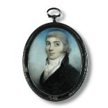 English School (18th Century) A memorial portrait miniature of a young gentleman wearing a blue coat