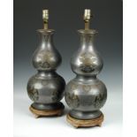 A pair of Chinese pewter and brass double gourd vases as lamps, each with overlaid brass foliate