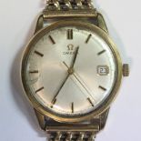 Omega - a gentleman's 9ct gold cased manual wind wristwatch, the silvered dial with gold coloured