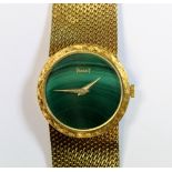 Piaget - A lady's 18ct gold cased wristwatch with engraved circular bezel, the malachite dial