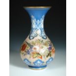 A mid 19th century French milk glass vase, painted with a band of flowers on a salmon ground between