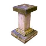 A stone garden sundial pedestal, early 19th century with panel outline decorated sides and ovolo