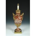 A gilt metal mounted rouge marble urn form lamp base, with fruiting vine handles and beading to