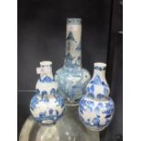 A pair of Chinese blue and white vases, 19cm high, and another Chinese blue and white vase, 31cm