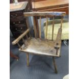 An 18th century ash and elm stick back armchair