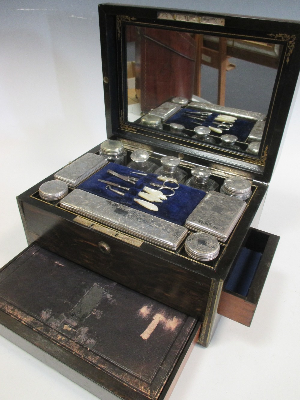 A Victorian coromandel ladies vanity box with fitted interior