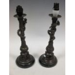 A pair of late 19th/early 20th century bronze candlesticks as lamps, 29cm high (2)