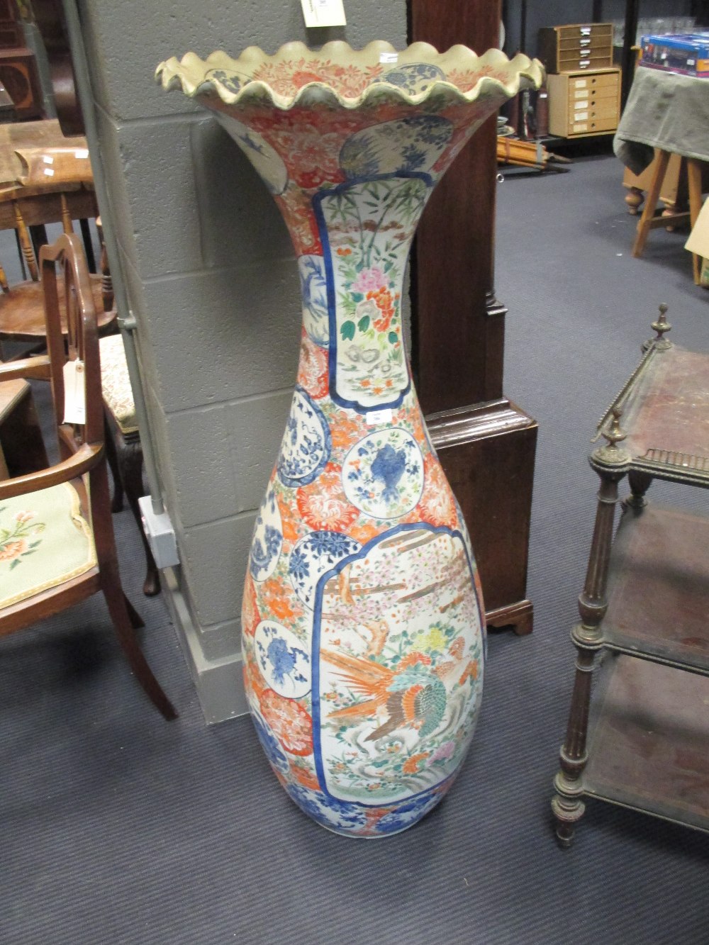 A large Imari vase, painted with fanciful birds, 124cm high