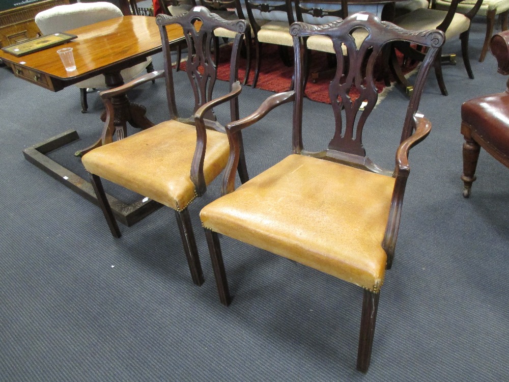 A pair of Victorian mahogany armchairs