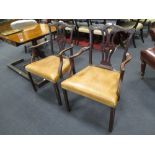 A pair of Victorian mahogany armchairs