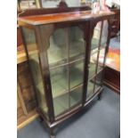 An Edwardian mahogany display cabinet with glass door (one broken), 135 x 92 x 35cm
