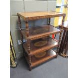 An early 19th century Dutch mahogany and inlaid four tier etagiere inlaid with trailing leaf borders