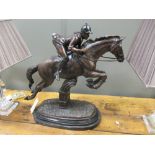 A modern bronze of a horse jumping with rider, on marble base, 64cm high x 61cm wide