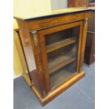 A late Victorian walnut and line inlaid pier cabinet on a plinth base