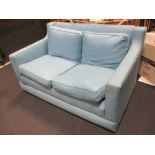 A Regency style two seater sofa upholstered in blue