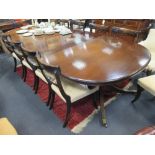 A Regency style mahogany D-end dining table with two leaves