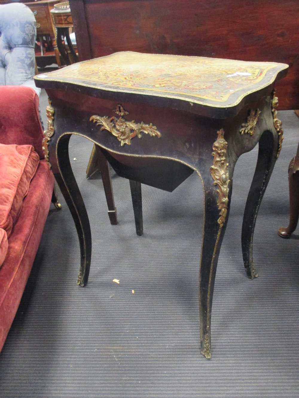 A late 19th century boulle sewing table, together with two 19th century mahogany chairs
