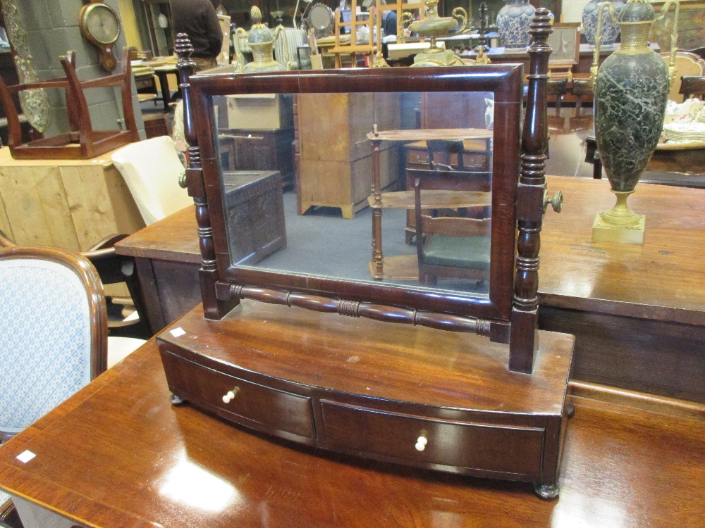 A Regency mahogany bow front dressing-table mirror with two drawers