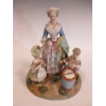 A Dresden porcelain group of mother and children with a drum