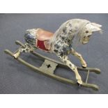 A mid 20th century dapple grey rocking horse, 84cm high