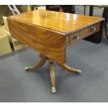 A Regency mahogany pedestal Pembroke table on hipped and swept reeded legs on brass casters, 72 x