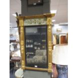A George III verre eglomise crested gilt framed rectangular mirror, 79 x 56cm