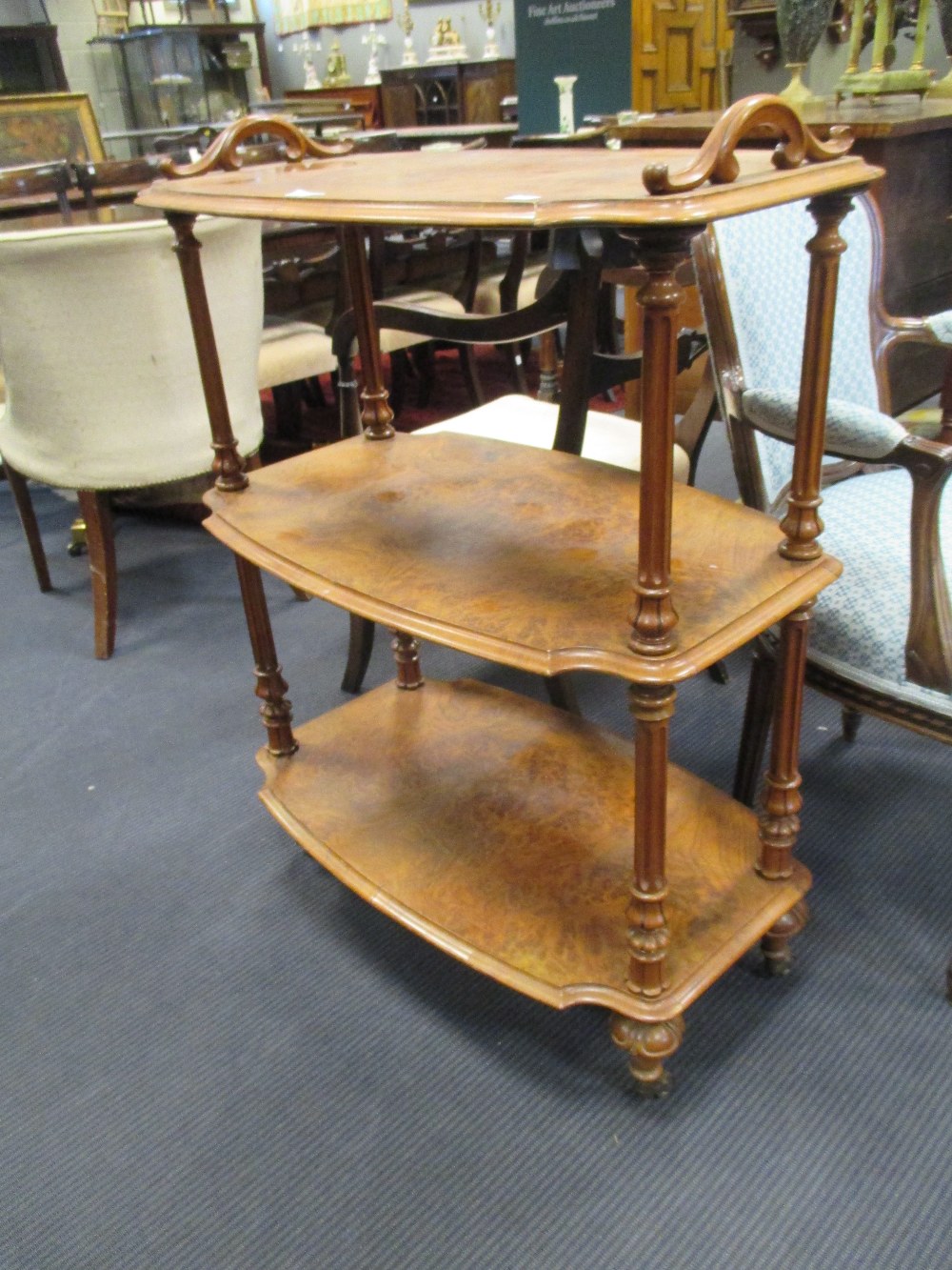 A Victorian walnut three tier whatnot