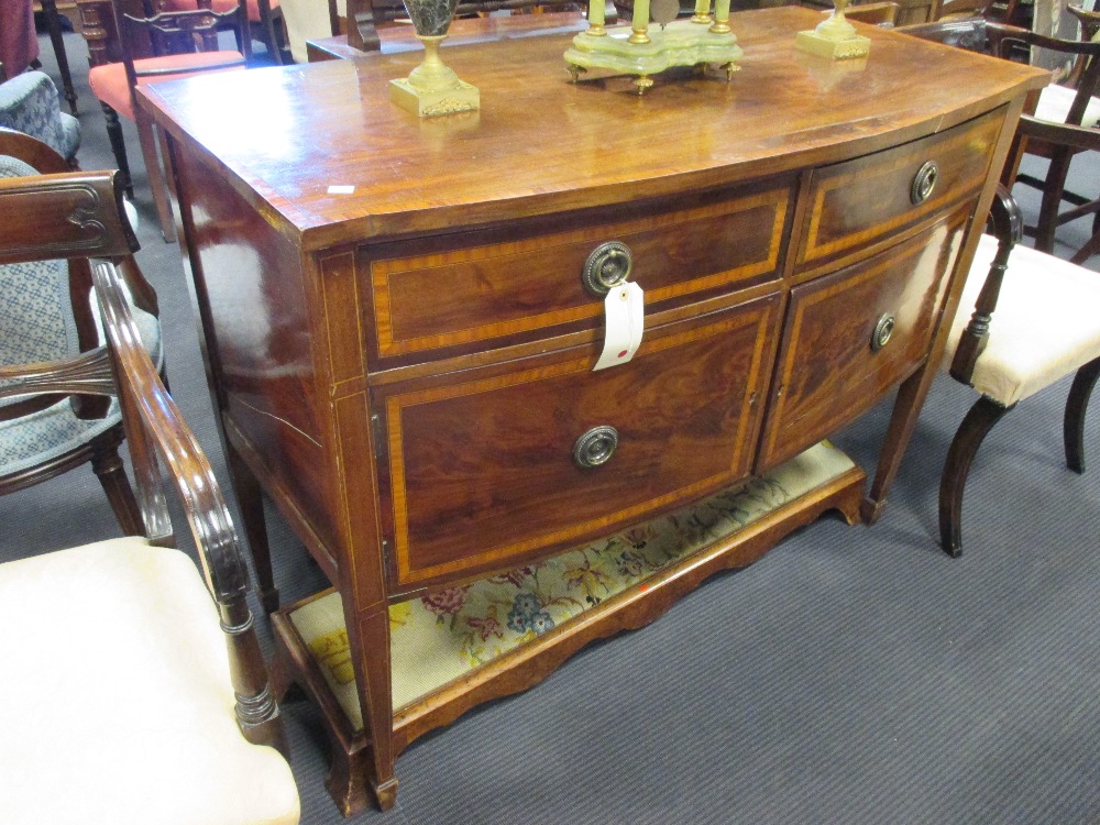 An Edwardian mahogany Sheraton revival bow front sideboard