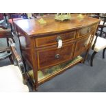 An Edwardian mahogany Sheraton revival bow front sideboard