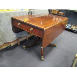 A George IV mahogany pedestal pembroke table with fittend end drawer, and satinwood and ebony line