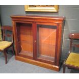 A 19th century mahogany glass front bookcase