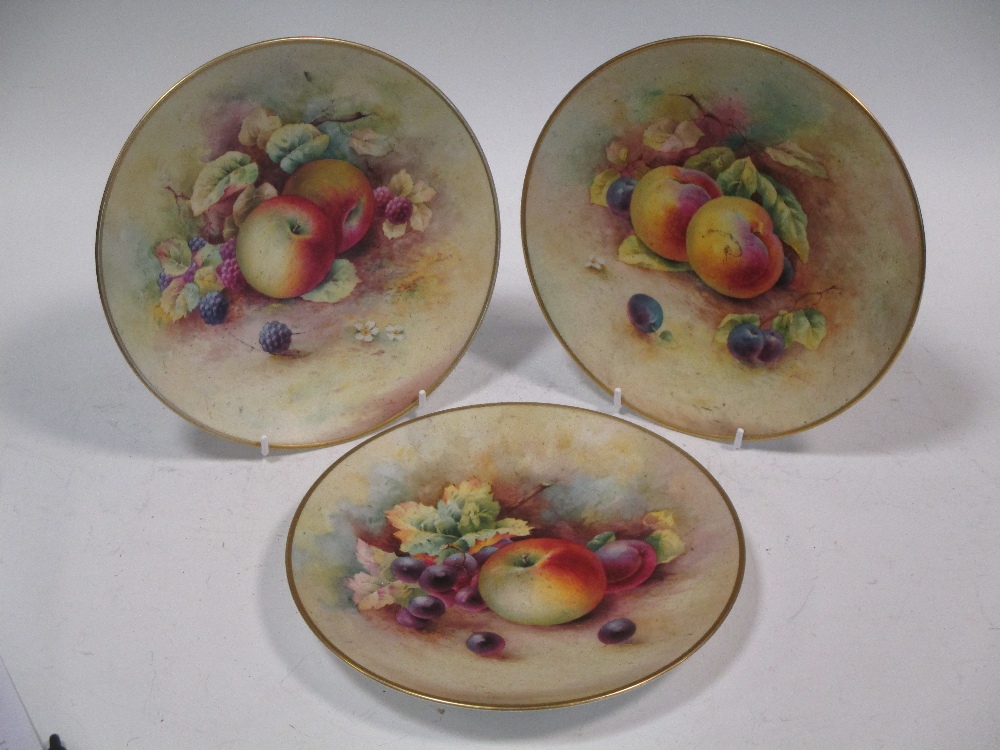 Three Minton cabinet plates painted with fruit signed by Woodhouse and Shufflebotham impressed