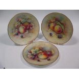 Three Minton cabinet plates painted with fruit signed by Woodhouse and Shufflebotham impressed