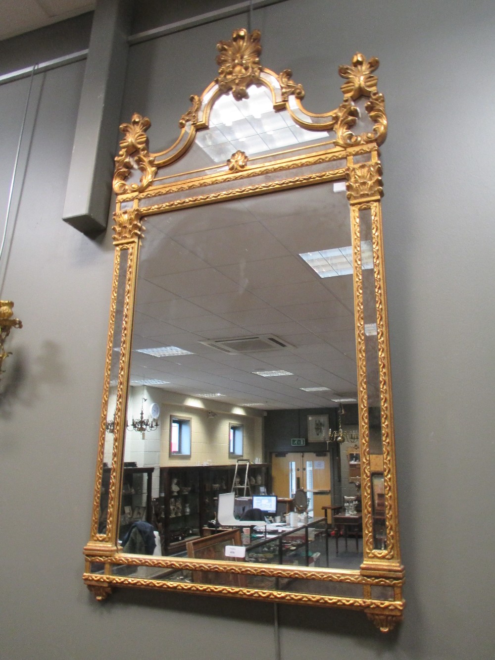 A modern gilt framed mirror in the Continental tradition, 122 x 62cm