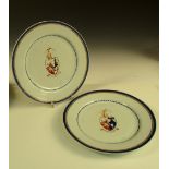 A pair of late 18th century armorial plates, the arms central to blue rim bands and above the