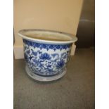 A 20th century blue and white planter and underdish, the interior of the flared rim with diamond